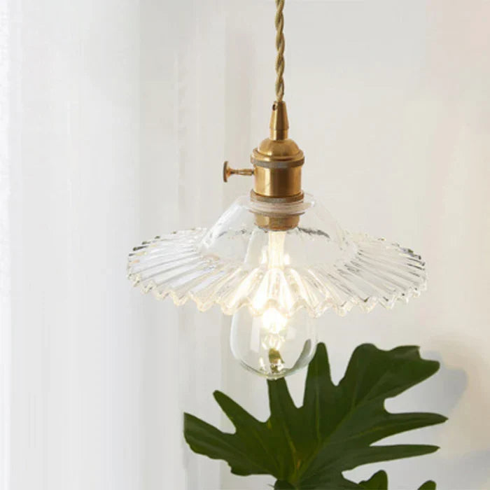 Close-up shot of the transparent glass fixture revealing polished metal hardware