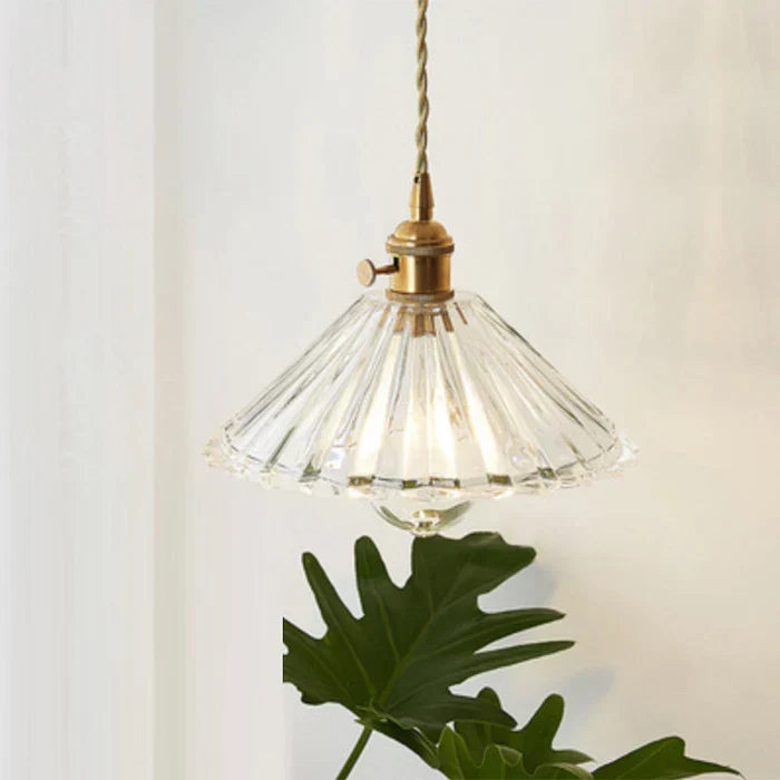 Transparent glass hanging lamp showcasing the interior bulb and industrial design