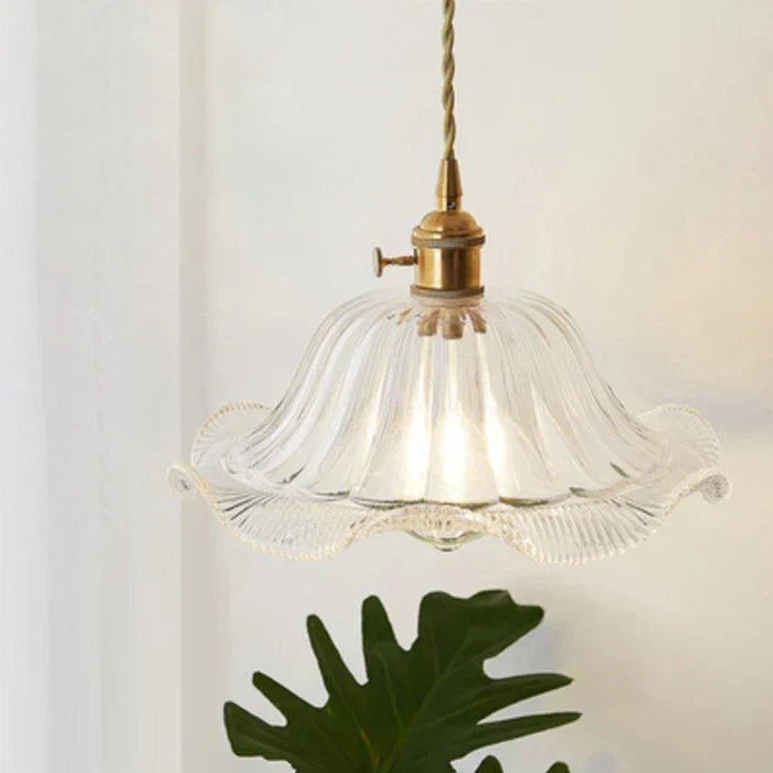 Contemporary glass lighting fixture illuminating a sleek kitchen island space
