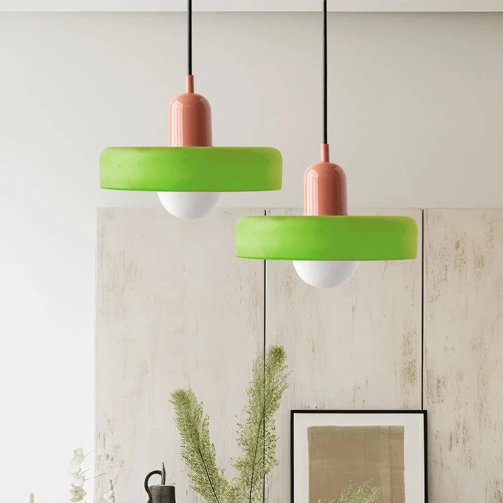 Kitchen counter illumination provided by a sleek glass hanging lamp
