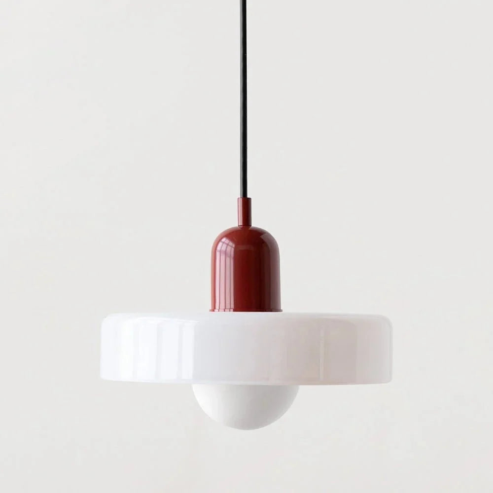 Dining room decor enhanced by a sleek suspended glass ceiling light