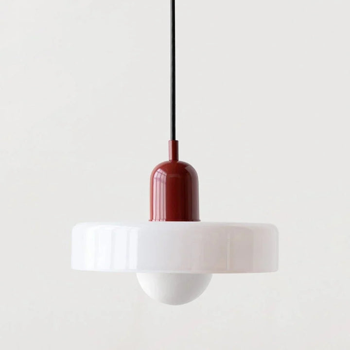 Dining room decor enhanced by a sleek suspended glass ceiling light