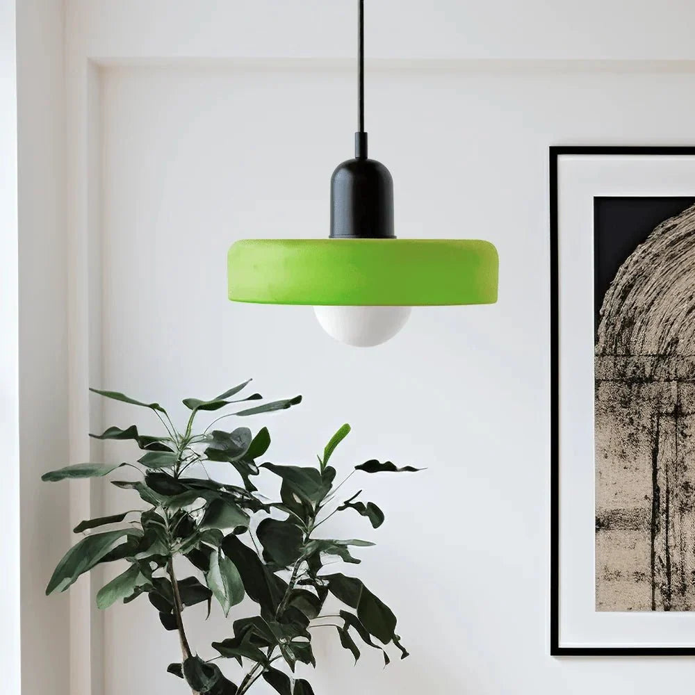 Stylish glass light fixture illuminating a contemporary breakfast bar