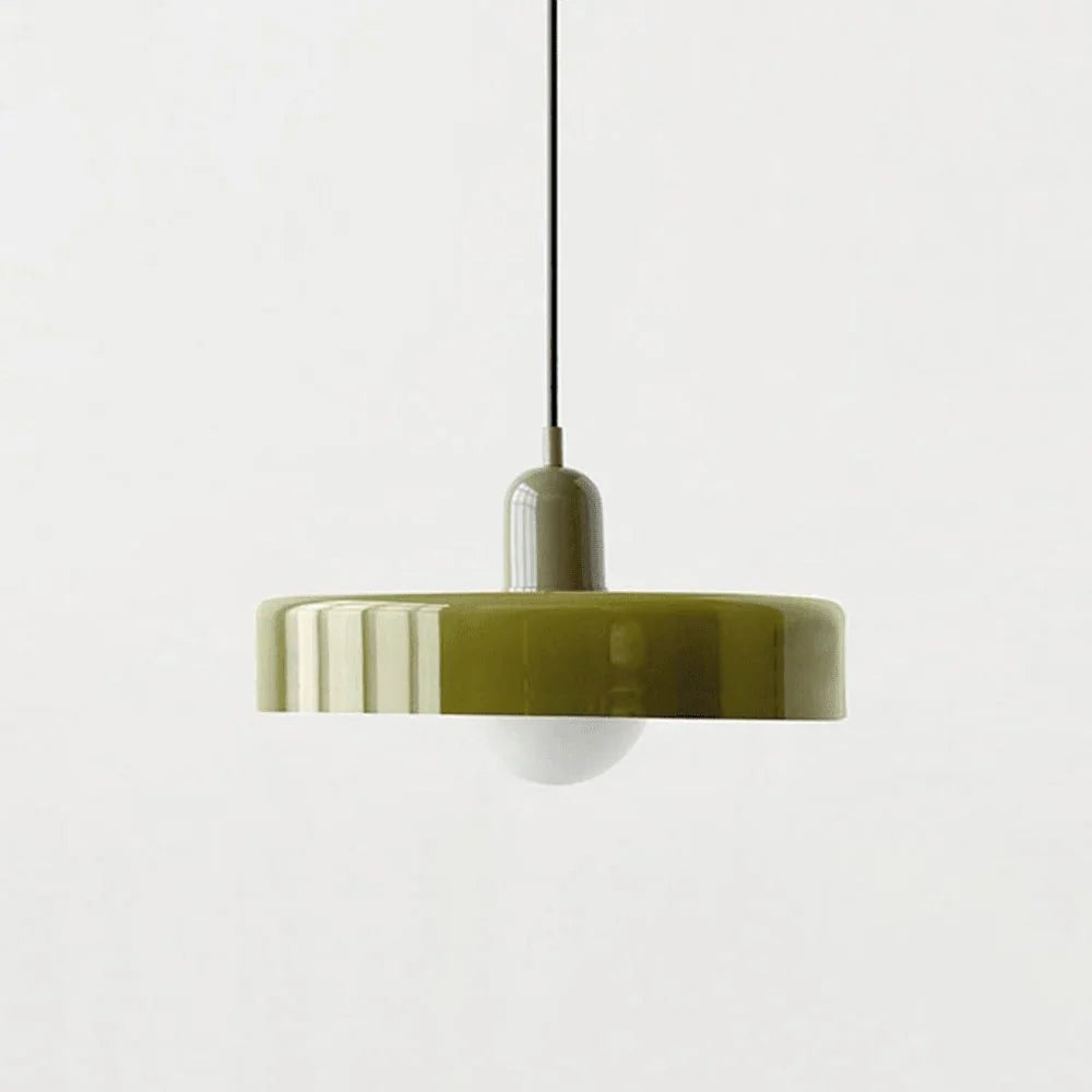 Adjustable drop light photographed against a neutral wall background