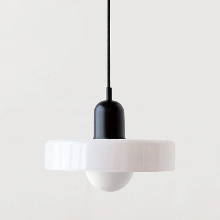 Indoor ceiling lighting featuring a clear glass shade and metallic hardware