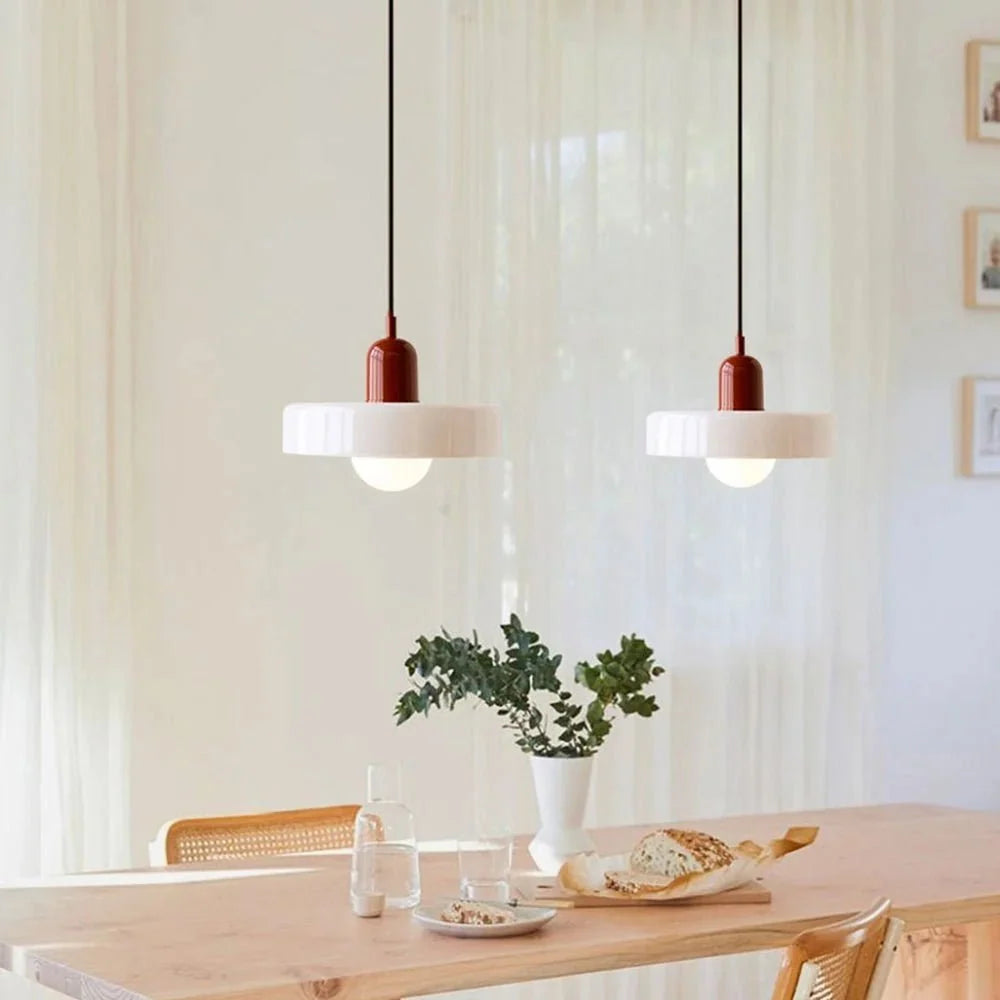 Minimalist ceiling pendant light hanging in a modern apartment