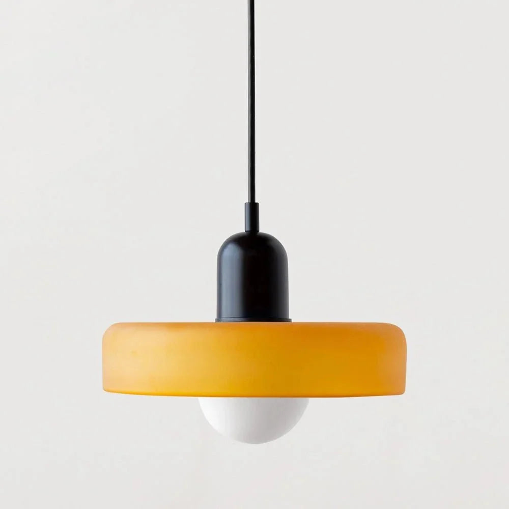 Adjustable drop light suspended in a stylish dining room decor setup