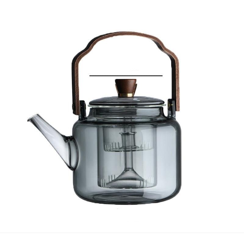 Elegant smoked glass teapot and infuser set styled for kitchen decor
