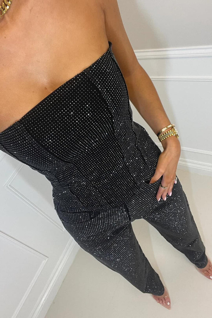 Detailed shot of the shimmering texture and pocket details on the Liora trouser set