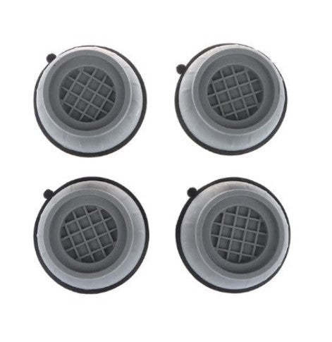 Four grey washing machine stabilizer pads viewed from above