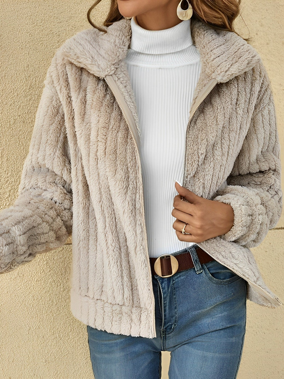 Model wearing the Gloria women's zip-up relaxed fit jacket in khaki color.