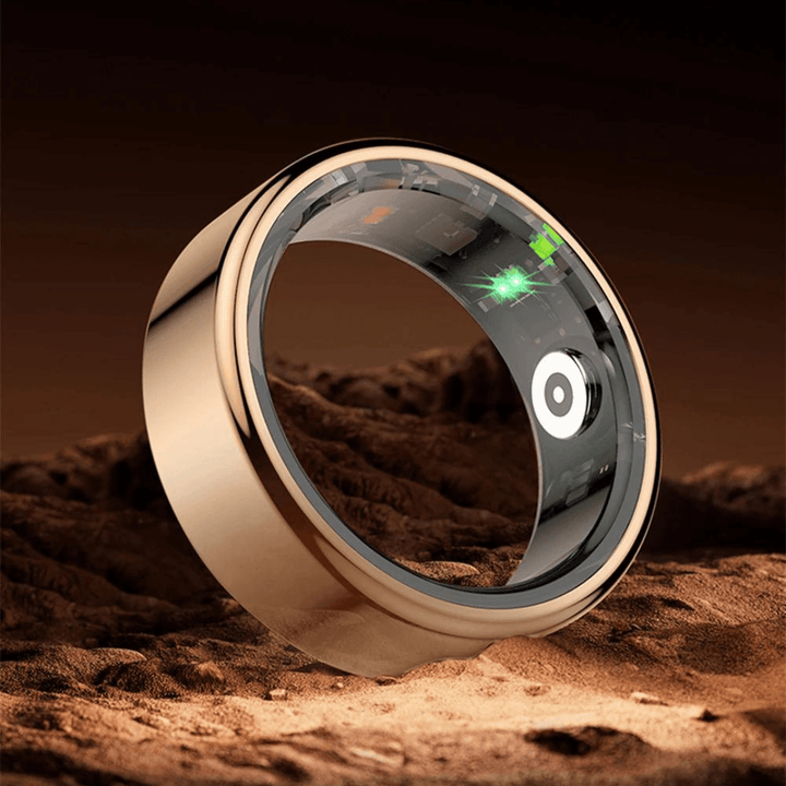 Sleek titanium smart health tracker ring on a white display surface