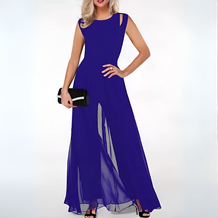 Front view of a woman wearing the royal blue version of the elegant party jumpsuit