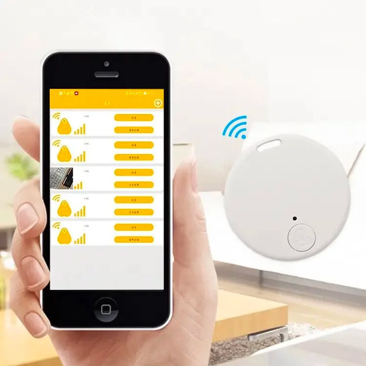 White cat GPS tracker device displayed next to a smartphone showing tracking app