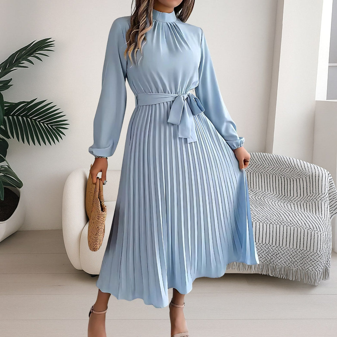 Women's pleated midi dress featuring a matching tie belt and long sleeves