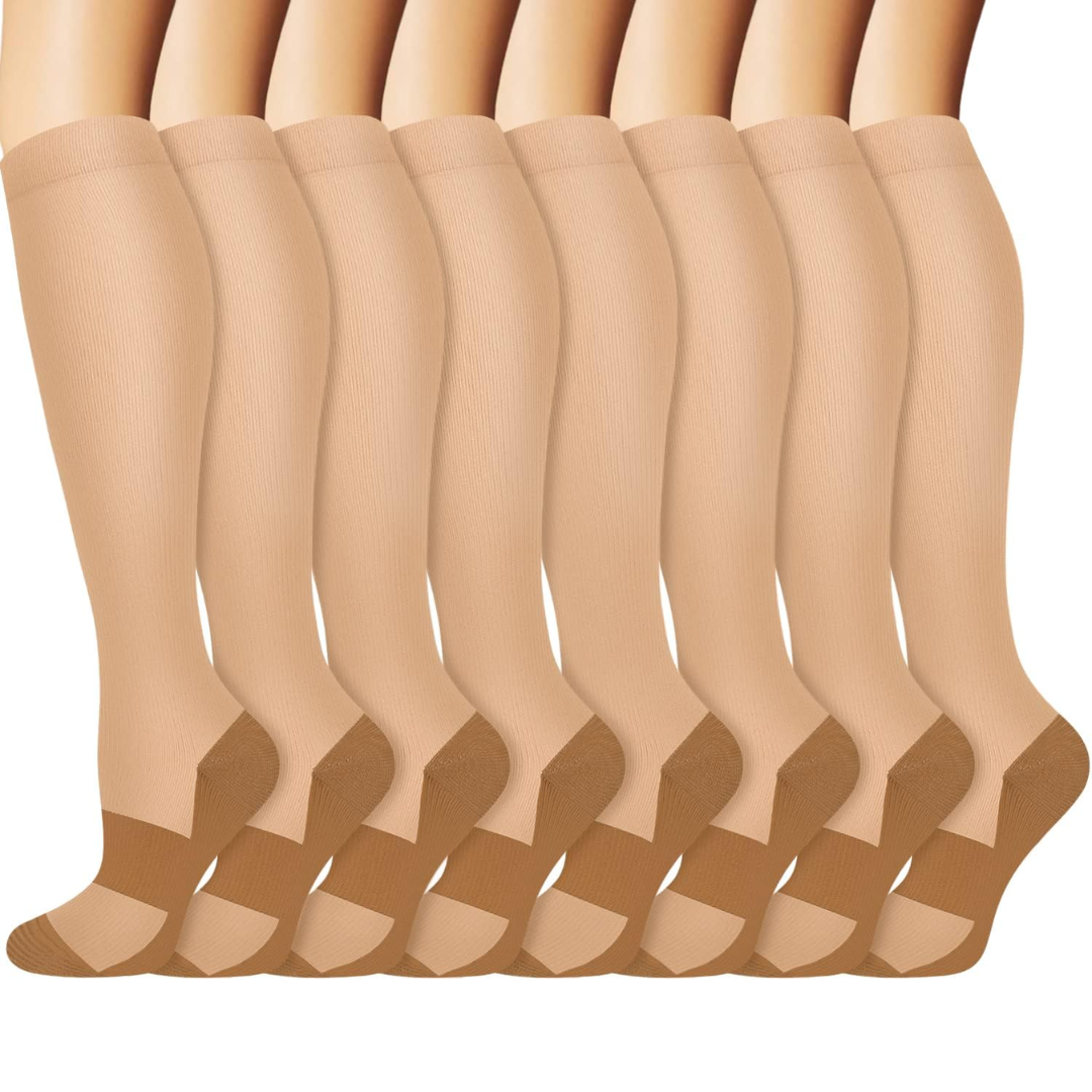 Nude tone compression socks stacked neatly in a multipack