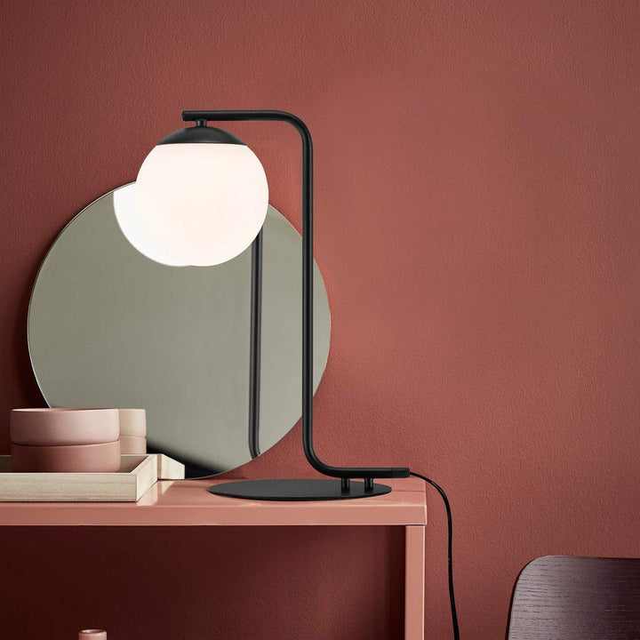 Grant Prestige black glass dome lamp styled on a pink console table