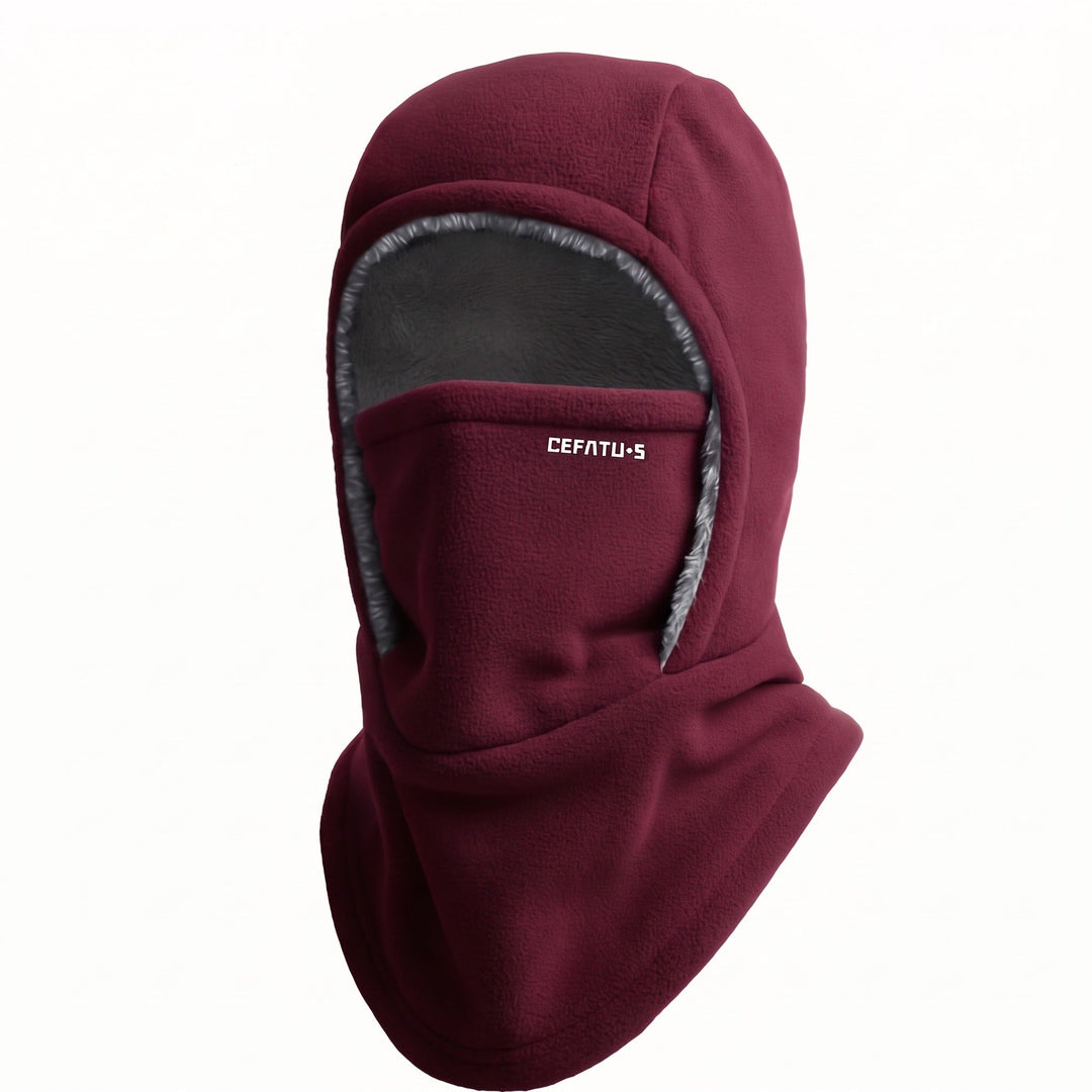 Outdoor enthusiast wearing thermal ski gear balaclava on snowy trails