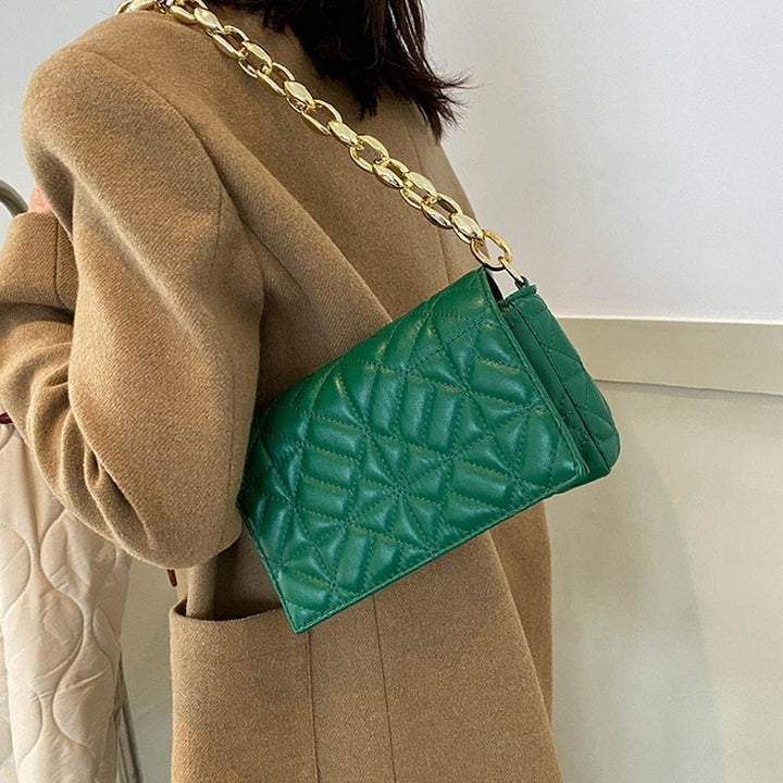 Green jacquard flap handbag worn on shoulder with gold chain