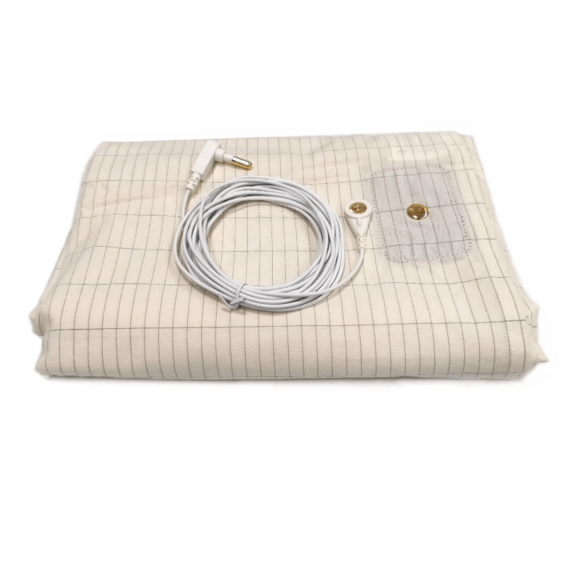 Folded beige grounding sheet with silver threads and connected grounding cable