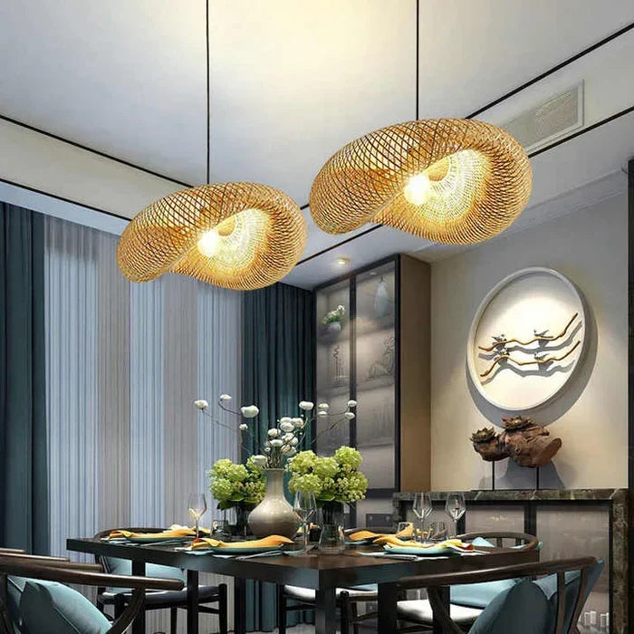 Handwoven bamboo pendant lamp illuminating a modern dining table setup