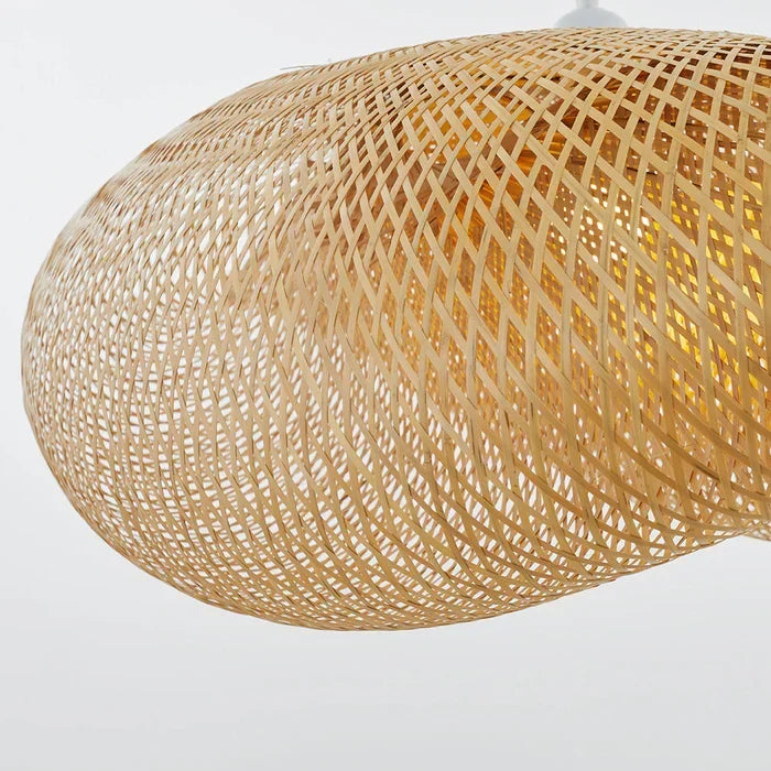 Dining room lighting featuring a natural rattan ceiling fixture over a wooden table