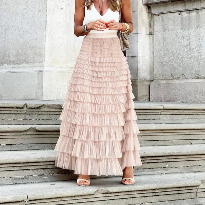 Back view of the flowy women's maxi skirt with a flattering high waist and comfortable tiered fit.
