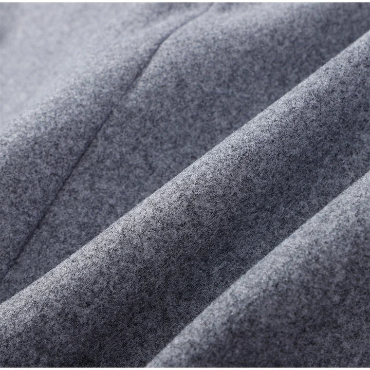 Side profile of gray high neck double-breasted womens coat