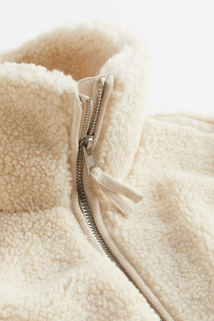Women's cozy teddy fleece jacket in beige, front view showcasing full zip