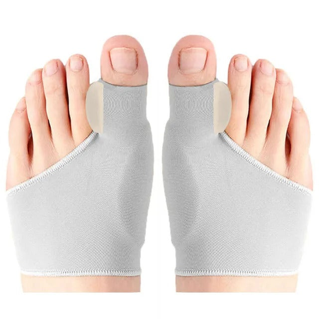 Gray hallux valgus toe corrector worn on feet