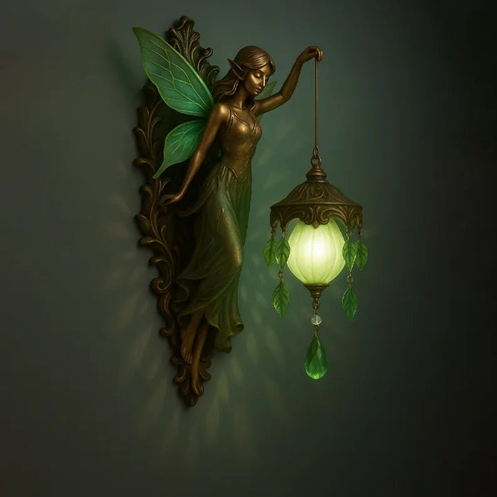 Fairy fantasy wall lamp featuring green wings and a glowing lantern fixture in a dark room