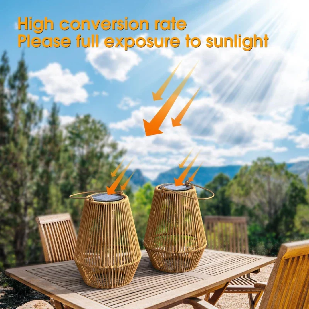 Two solar garden lanterns placed outdoors on a wooden table in sunlight
