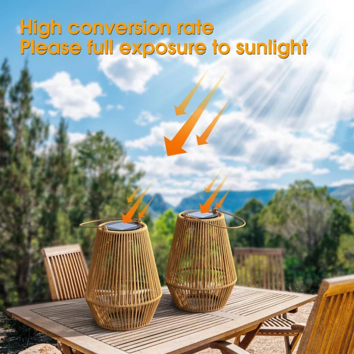 Two solar garden lanterns placed outdoors on a wooden table in sunlight