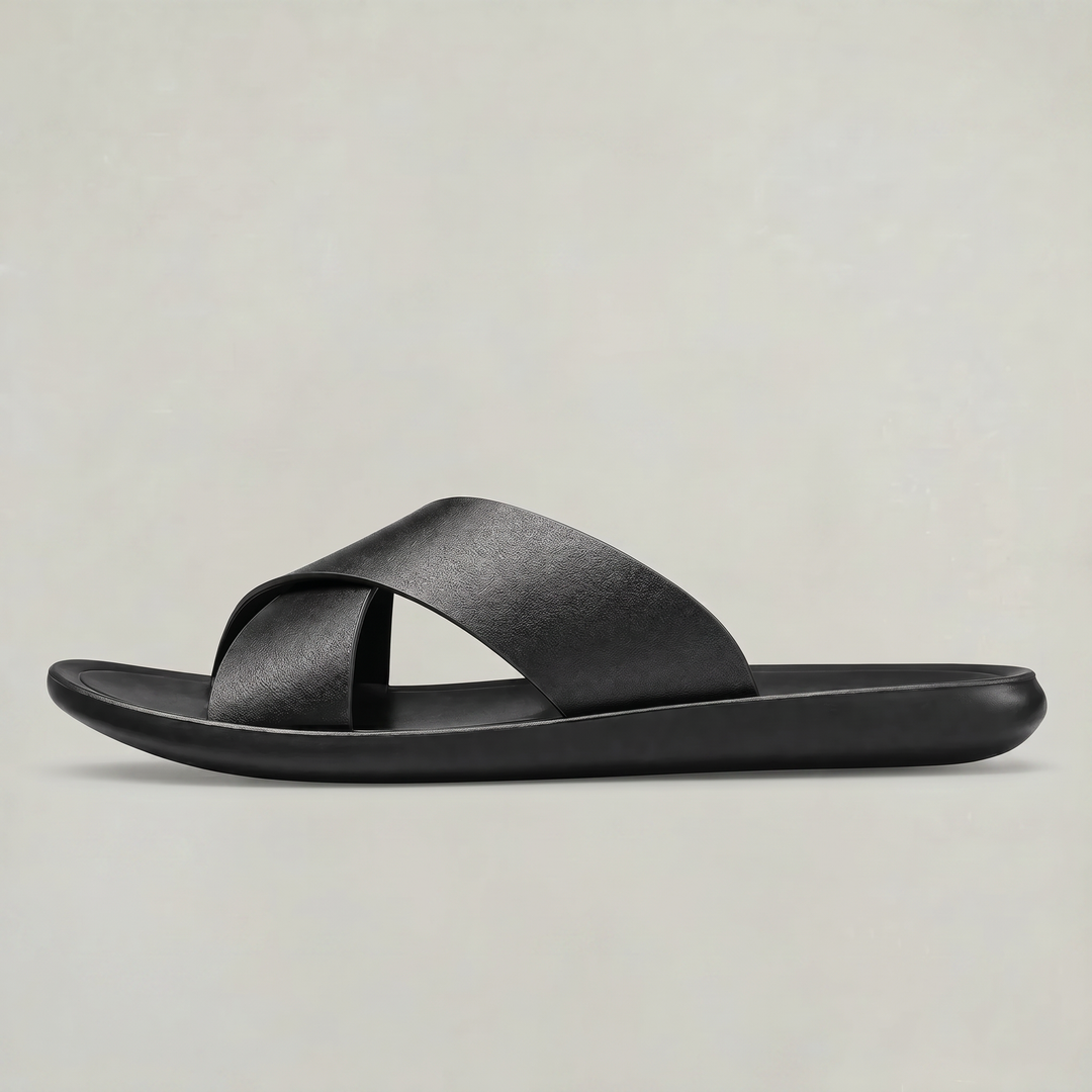 Side profile of men's black cross strap slide sandal