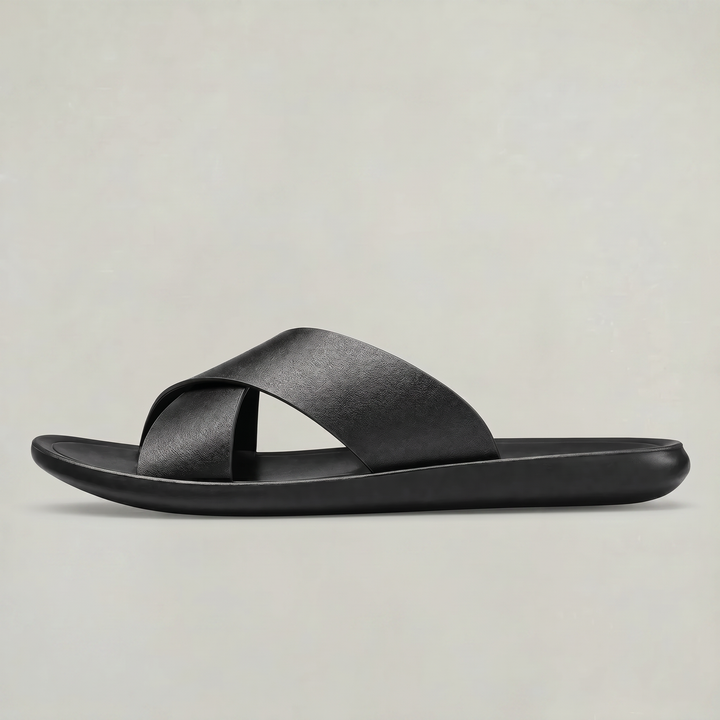 Side profile of men's black cross strap slide sandal