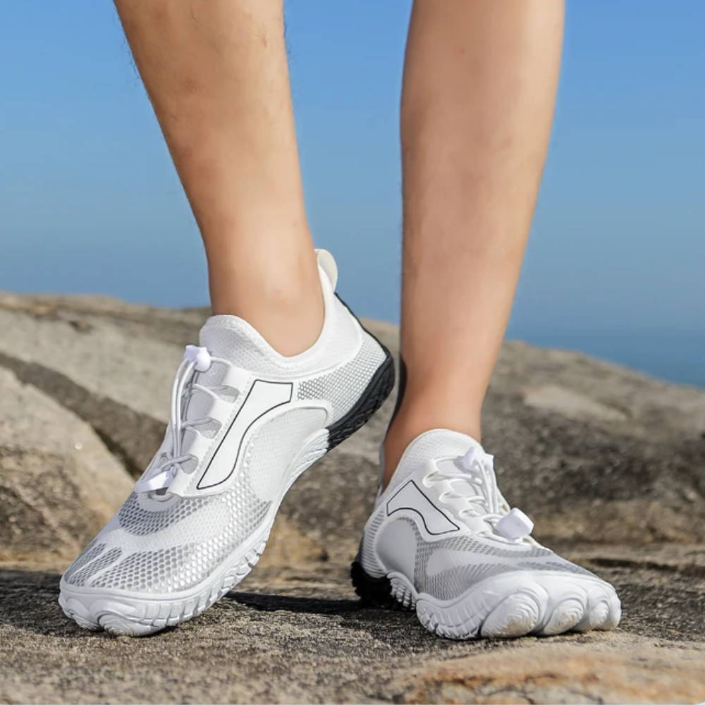 White water shoes with mesh upper on rocky terrain