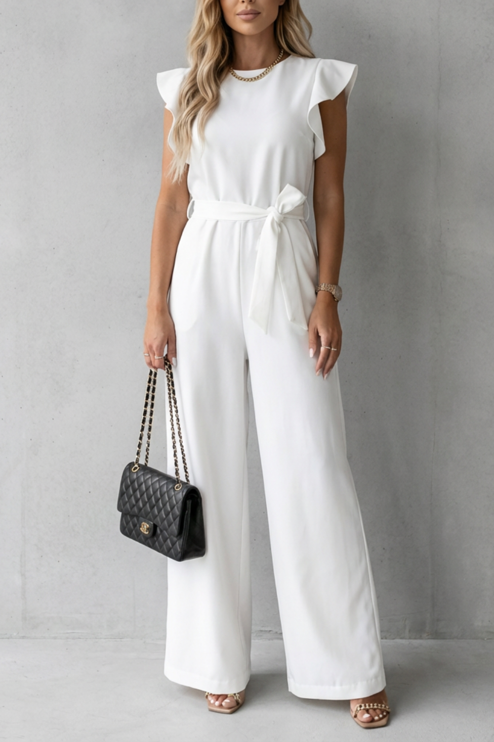 Women's elegant ruffle sleeve belted wide-leg jumpsuit front view in evening wear style