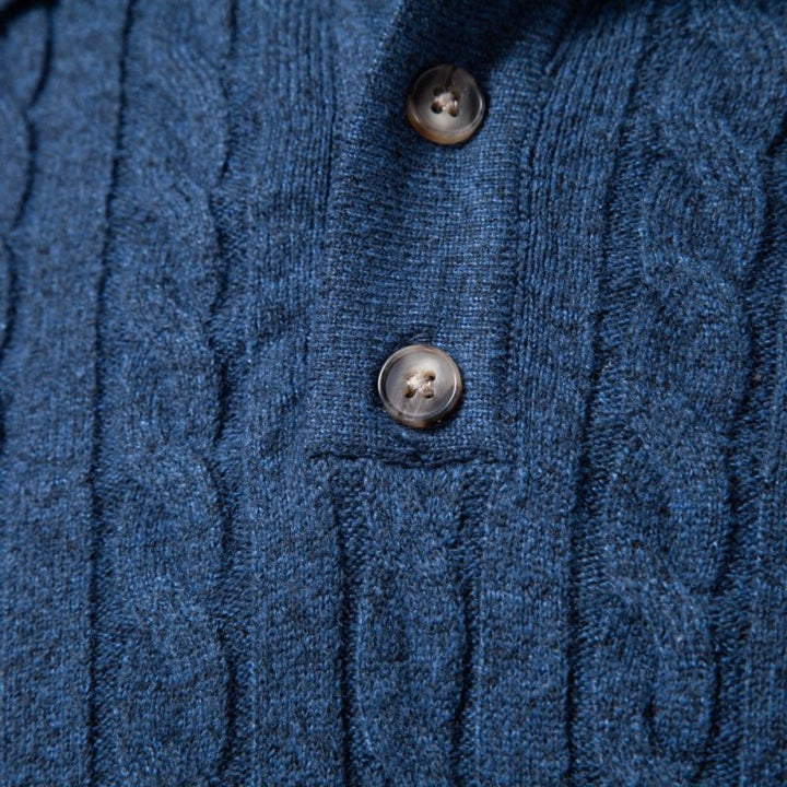 Hemline and fine stitch detail of men's cable knit fashion polo