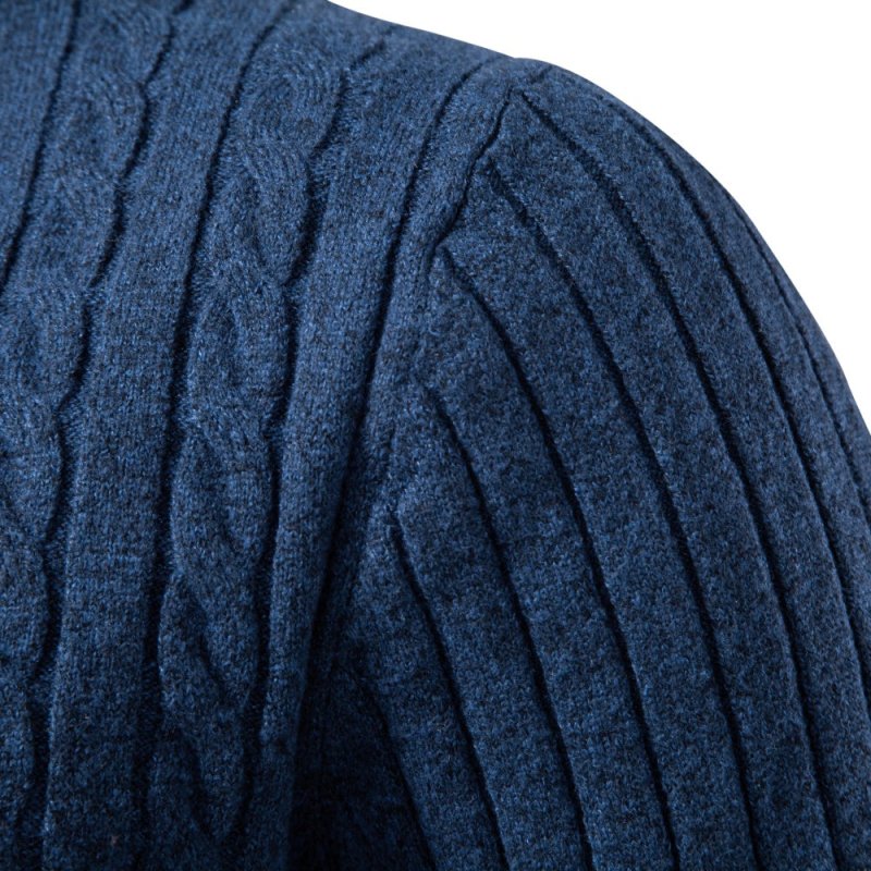 Textured weave pattern close-up on a men's long sleeve knitted polo top