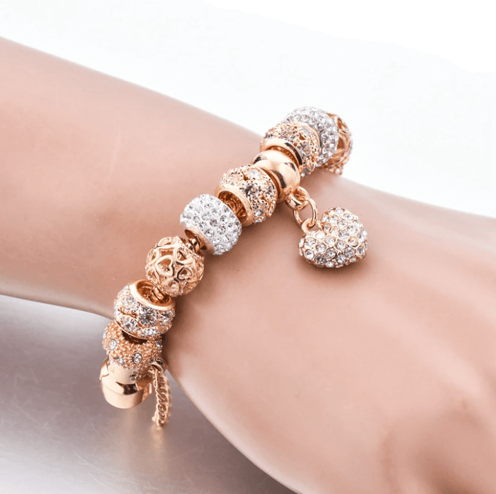 Womens gift idea gold crystal heart charm bracelet wrist shot