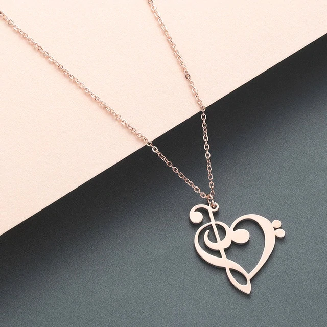 Rose gold music lover heart necklace displayed elegantly