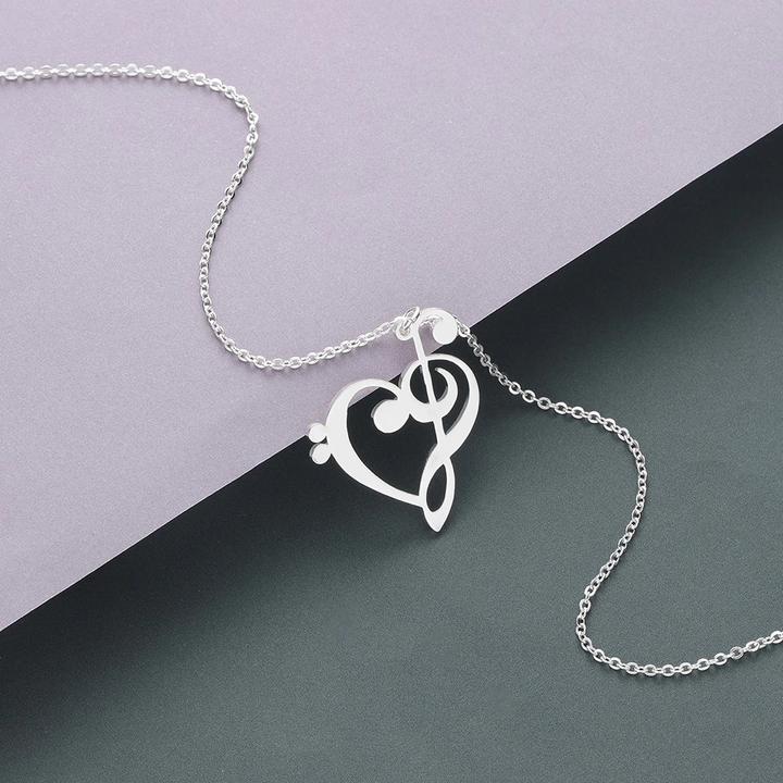 Close up of the musical heart pendant necklace featuring delicate craftsmanship