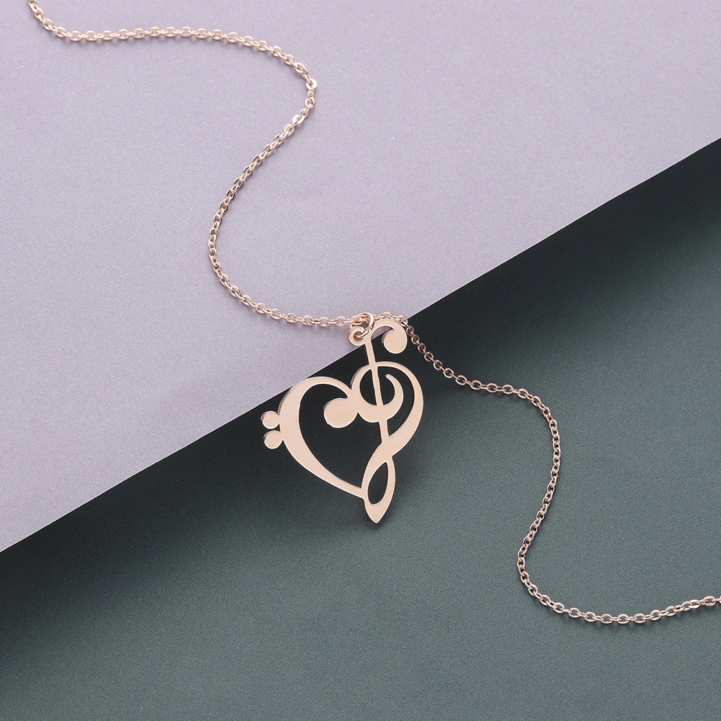 Model wearing the elegant silver music note heart pendant necklace