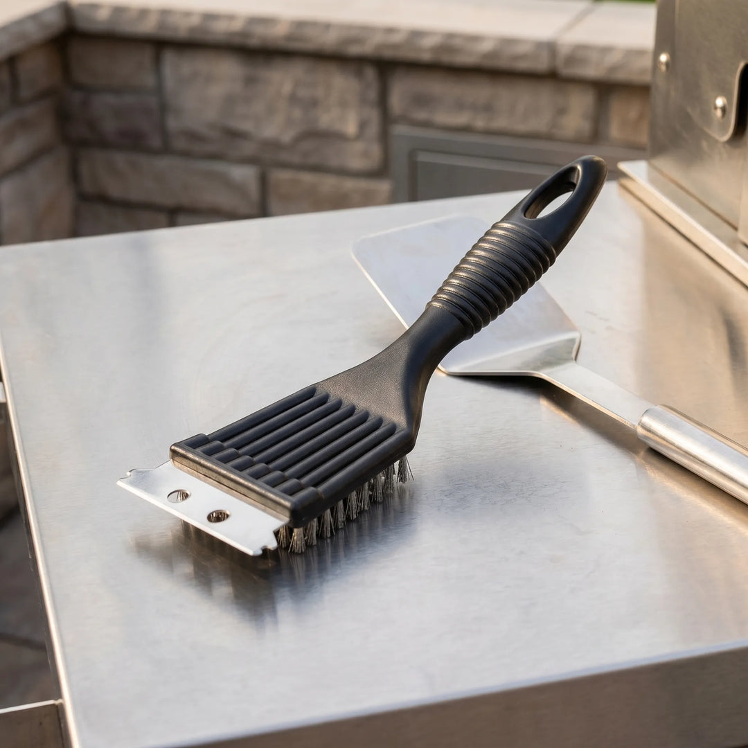 Heavy-duty outdoor barbecue cleaner resting on a stainless steel outdoor kitchen counter