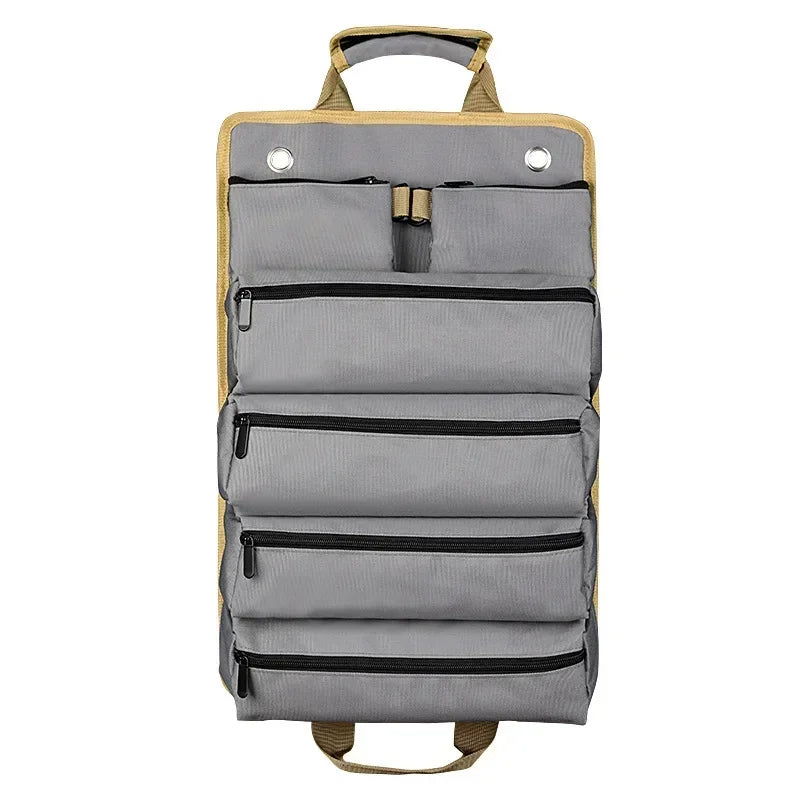Heavy-duty roll-up tool bag organizer laid flat showing multiple zippered pockets