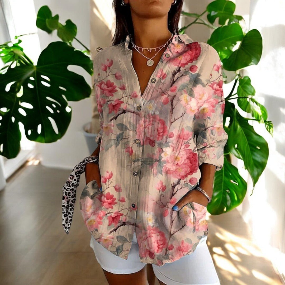 Fabric texture closeup of the womens artistic floral blouse