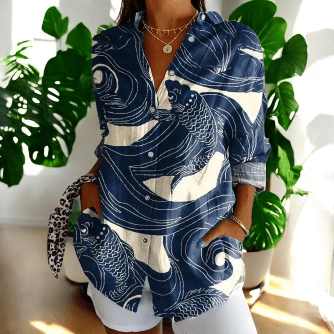 Woman wearing blue abstract print long sleeve button-up blouse