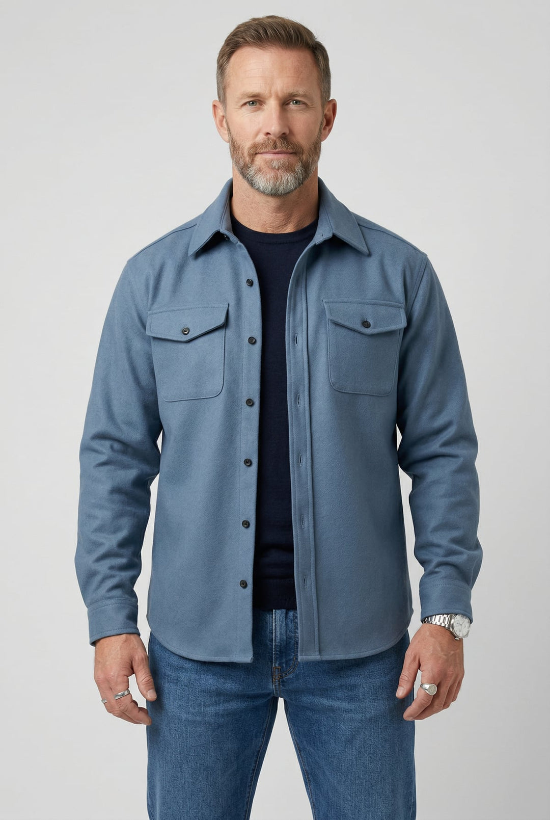 Front view of a man wearing a light blue overshirt jacket with chest pockets