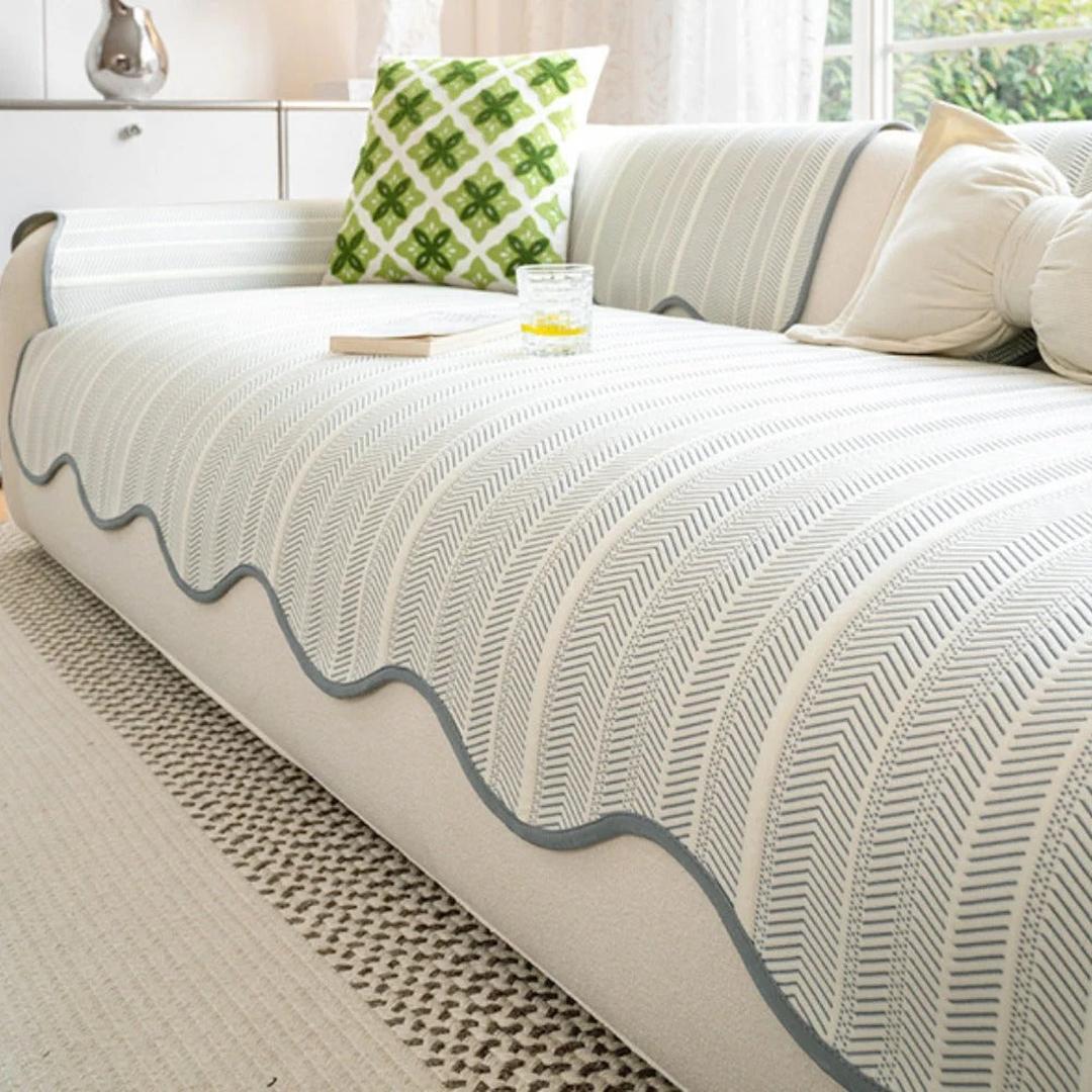 Sofa cover with blue edge accent showing textured herringbone weave pattern