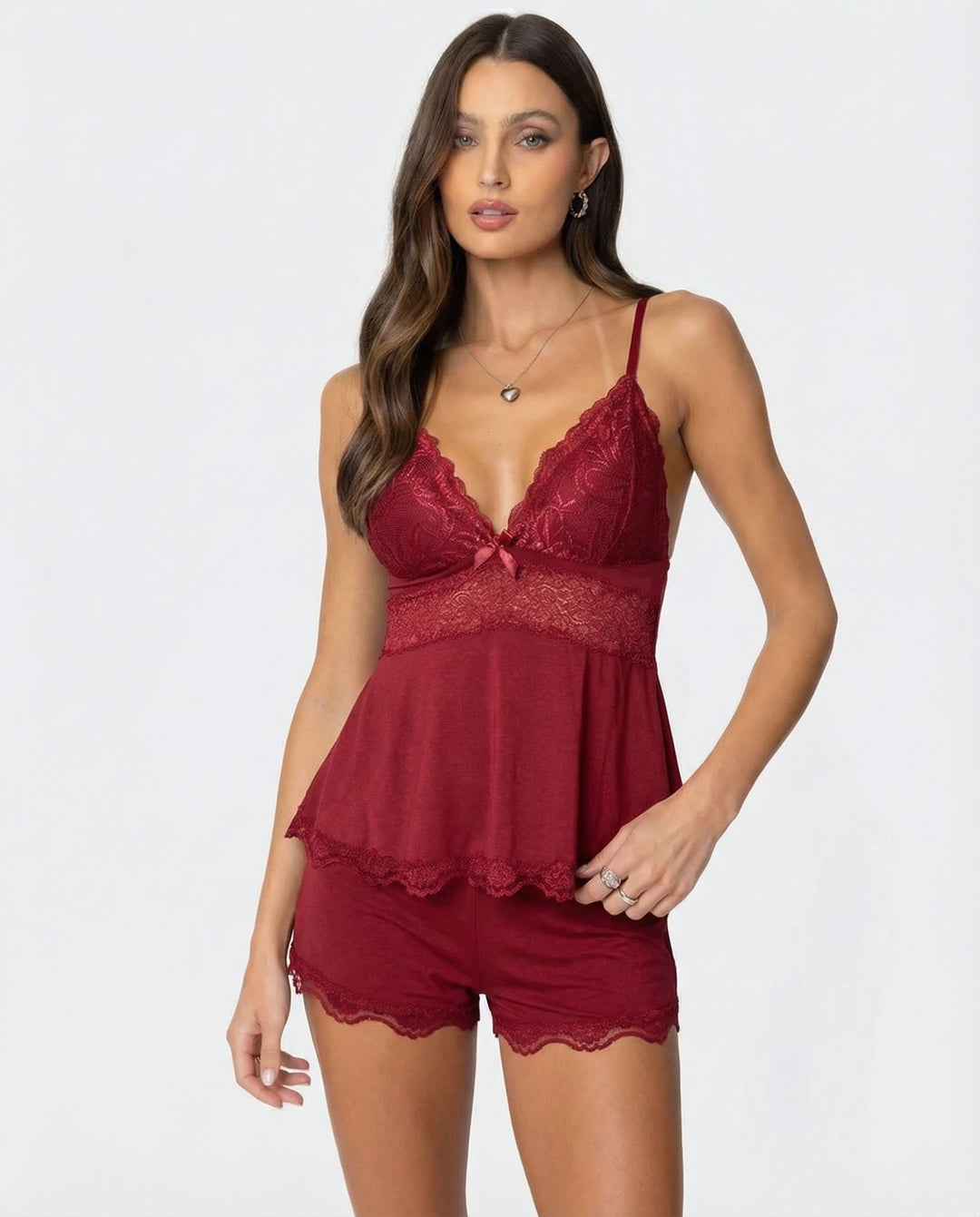 Close-up of v-neck cami with delicate black lace trim